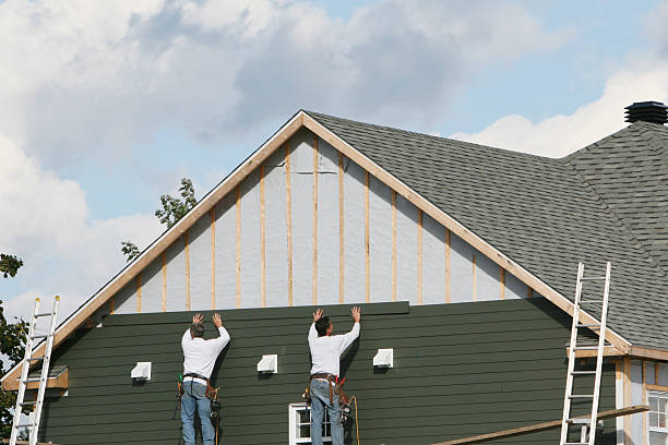 Professional Storm Damage Siding Repair technician working in Marshall, MN